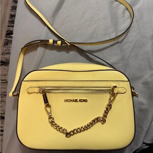 Michael Kors small saffron yellow crossbody with matching keychain wallet.